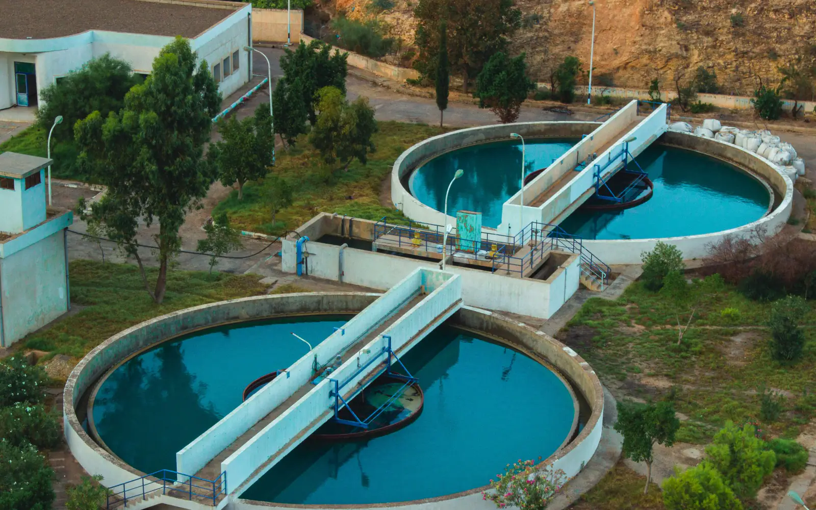 Circular clarifier tanks at a water treatment works, seen from above