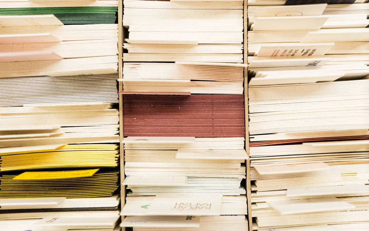 Stacked documents in coloured covers