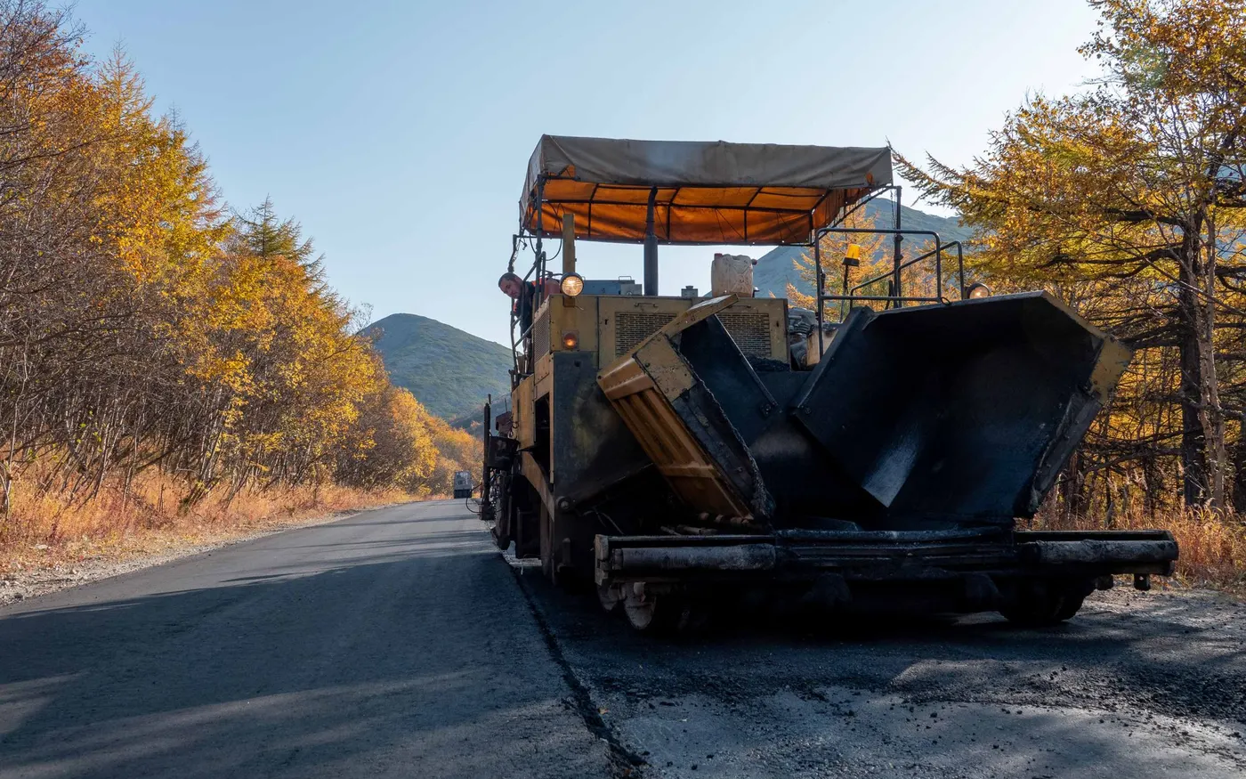 A paving machine laying surfacing on a highway
