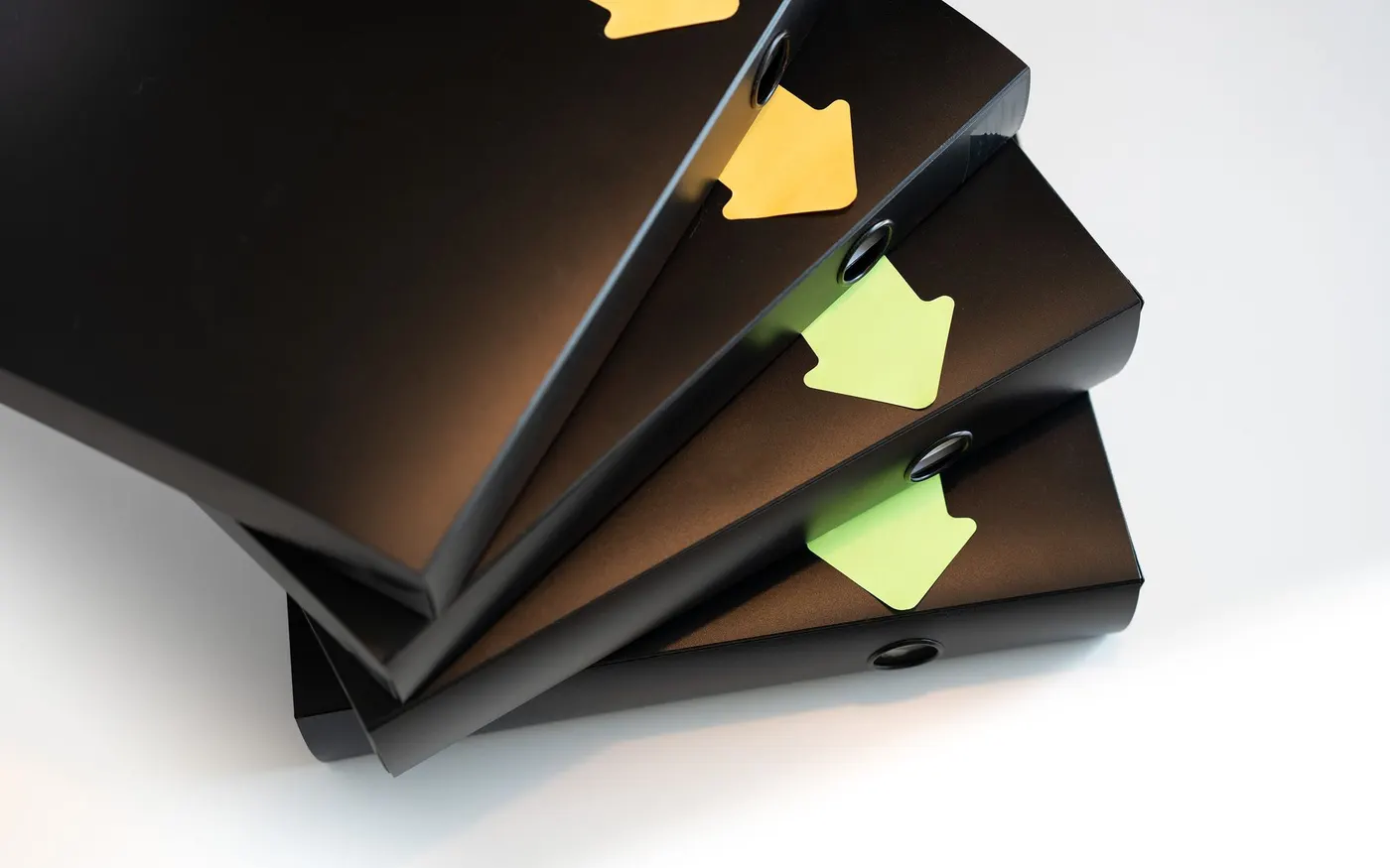 Ring binders stacked with labelled spines