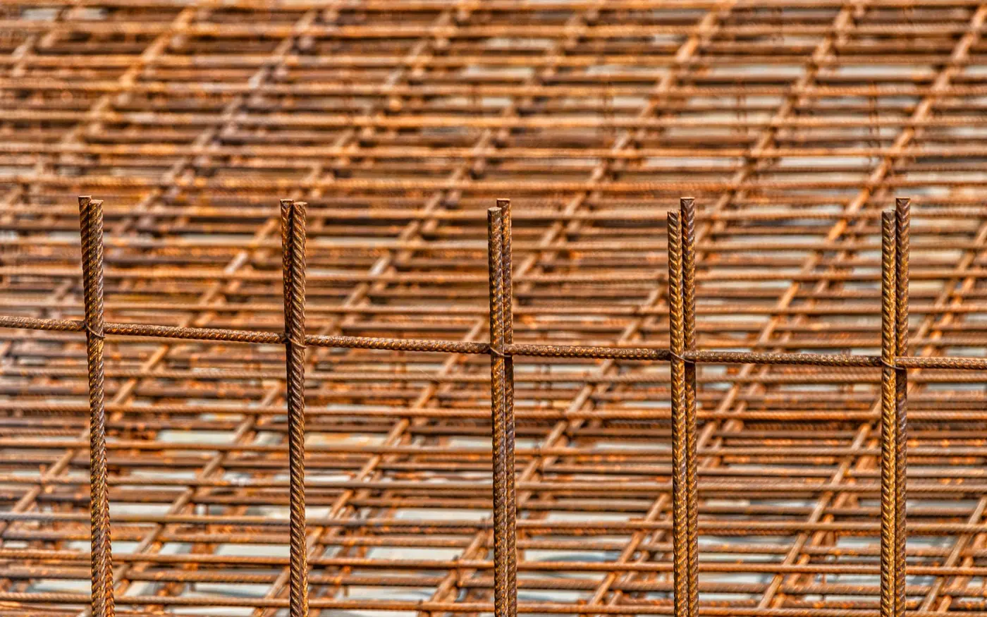 Stacked steel reinforcement mesh on a construction site